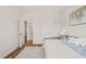 Neutral colored bedroom featuring a day bed, gray rug, and hardwood floors at 2636 Nordmann Fir Rd, Raleigh, NC 27616