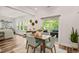 Well lit dining area with access to a patio at 2636 Nordmann Fir Rd, Raleigh, NC 27616