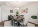 Stylish dining room with hardwood floors, a modern chandelier, and room to entertain at 2636 Nordmann Fir Rd, Raleigh, NC 27616