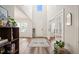 Bright foyer featuring a high ceiling, hardwood floors, and a stylish area rug at 2636 Nordmann Fir Rd, Raleigh, NC 27616