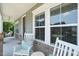 Charming front porch with rocking chairs, a swing, and beautiful natural light at 2636 Nordmann Fir Rd, Raleigh, NC 27616