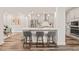 Contemporary kitchen with a large island with counter seating and stainless steel appliances at 2636 Nordmann Fir Rd, Raleigh, NC 27616