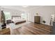 Spacious primary bedroom with hardwood floors, neutral walls, recessed lighting, and a king bed at 2636 Nordmann Fir Rd, Raleigh, NC 27616