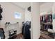Organized walk-in closet with built in shelves and rods to maximize storage at 2636 Nordmann Fir Rd, Raleigh, NC 27616