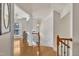 Elegant foyer with wood floors and staircase leading to the upper level and a view of the dining room at 2744 Laurelcherry St, Raleigh, NC 27612