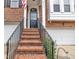 Front entrance featuring brick steps with an iron railing leading to the front door at 2744 Laurelcherry St, Raleigh, NC 27612