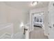 Hallway leading to a bedroom, with light carpet and a staircase to the left at 2744 Laurelcherry St, Raleigh, NC 27612