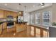 Eat-in kitchen features stainless steel appliances, an island, and light wood cabinetry at 2744 Laurelcherry St, Raleigh, NC 27612