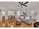 Open concept living room with hardwood floors, modern furnishings, and lots of light at 2744 Laurelcherry St, Raleigh, NC 27612