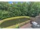 Aerial view of property revealing deck, Weber grill, pond, fountain and privacy landscaping at 2744 Laurelcherry St, Raleigh, NC 27612