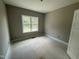 Empty bedroom with a large window providing natural light, ready for personalization and decor at 2744 Rains Mill Rd, Princeton, NC 27569