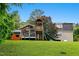 Expansive backyard with well-maintained lawn and a charming wooden playset at 2805 Friendship Rd, Durham, NC 27705