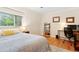 Bedroom featuring a comfortable bed, desk, and hardwood floors, ideal for relaxation and productivity at 2805 Friendship Rd, Durham, NC 27705