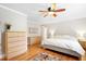 Cozy bedroom featuring hardwood floors, ceiling fan, and neutral tones, creating a relaxing atmosphere at 2805 Friendship Rd, Durham, NC 27705