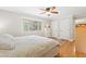 Bright bedroom with hardwood floors, a large window, and ample closet space at 2805 Friendship Rd, Durham, NC 27705