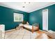 Cozy bedroom with hardwood floors, a plush rug, and a window offering natural light at 2805 Friendship Rd, Durham, NC 27705