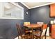 Cozy breakfast nook showcases a round wooden table, four chairs, and a bright window at 2805 Friendship Rd, Durham, NC 27705