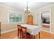 Welcoming dining room features hardwood floors, neutral paint, and decorative light fixture at 2805 Friendship Rd, Durham, NC 27705