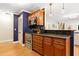 Stylish kitchen with stainless appliances, granite countertops, wood cabinetry and hardwood floors at 2805 Friendship Rd, Durham, NC 27705