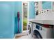 Convenient laundry room with ample shelving, washer, dryer, and a window with a view of backyard at 2805 Friendship Rd, Durham, NC 27705