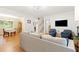 Bright living room features hardwood floors, with neutral decor and open floor plan flowing into dining area at 2805 Friendship Rd, Durham, NC 27705