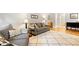 Cozy living room featuring hardwood floors, neutral paint, and comfortable seating at 2805 Friendship Rd, Durham, NC 27705