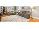Comfortable living room with hardwood floors, neutral paint, and cozy seating at 2805 Friendship Rd, Durham, NC 27705