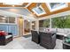 Comfortable screened porch with skylights, outdoor seating, and access to the backyard at 2805 Friendship Rd, Durham, NC 27705