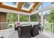 Inviting screened porch with stylish outdoor furniture, perfect for relaxing and entertaining at 2805 Friendship Rd, Durham, NC 27705