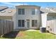 View of the home's backyard, showcasing the fenced yard and patio area at 2822 Pickett Rd # 132, Durham, NC 27705