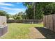 Backyard with a wooden fence and lawn at 2822 Pickett Rd # 132, Durham, NC 27705