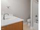Bathroom featuring a single sink, tile floors, and a shower with glass doors at 2822 Pickett Rd # 132, Durham, NC 27705