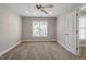 Bedroom with a ceiling fan and a window bringing natural light at 2822 Pickett Rd # 132, Durham, NC 27705