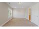 Bright bedroom featuring carpeted floors, neutral walls, and a window providing natural light at 2822 Pickett Rd # 132, Durham, NC 27705