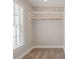 Walk-in closet with built-in shelving and a window at 2822 Pickett Rd # 132, Durham, NC 27705