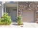 Charming townhouse with a stone front, a one-car garage, and nicely landscaped entrance at 2822 Pickett Rd # 132, Durham, NC 27705