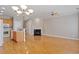 Open-concept living space featuring kitchen, fireplace, and hardwood floors and lots of open space at 2822 Pickett Rd # 132, Durham, NC 27705