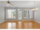 Spacious living room features gleaming hardwood floors, neutral paint, and abundant natural light at 2822 Pickett Rd # 132, Durham, NC 27705