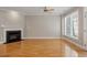 Living room with hardwood floors, fireplace, and natural light coming through the windows at 2822 Pickett Rd # 132, Durham, NC 27705