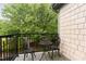 Charming balcony featuring ornate chairs and table, with a view of lush trees at 301 Presque Isle Ln, Chapel Hill, NC 27514