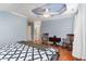 Spacious bedroom features hardwood floors, crown moulding and a seating area for relaxation at 301 Presque Isle Ln, Chapel Hill, NC 27514