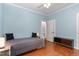 Comfortable bedroom with wood floors, crown moulding, and plenty of space, bathed in soft, natural light at 301 Presque Isle Ln, Chapel Hill, NC 27514