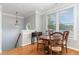 Dining area with hardwood flooring, natural light, and a view from the window at 301 Presque Isle Ln, Chapel Hill, NC 27514