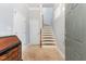 Inviting foyer with tiled floor, staircase, and elegant chest of drawers providing an airy welcome at 301 Presque Isle Ln, Chapel Hill, NC 27514