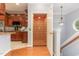 Beautiful interior view featuring hardwood floors, an elevator, and a partial kitchen view at 301 Presque Isle Ln, Chapel Hill, NC 27514