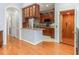 Kitchen area featuring wood cabinets, granite countertops, an elevator, and stainless steel appliances at 301 Presque Isle Ln, Chapel Hill, NC 27514
