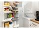 Pantry featuring organized shelving and a washer and dryer at 301 Presque Isle Ln, Chapel Hill, NC 27514