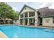 Community pool with a covered patio area and ample seating at 301 Presque Isle Ln, Chapel Hill, NC 27514