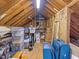 Spacious attic used for storage and featuring open wood beams and ceiling at 310 Heidinger Dr, Cary, NC 27511