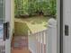 View of backyard with a wooded lot from a door on the back porch of the home at 310 Heidinger Dr, Cary, NC 27511
